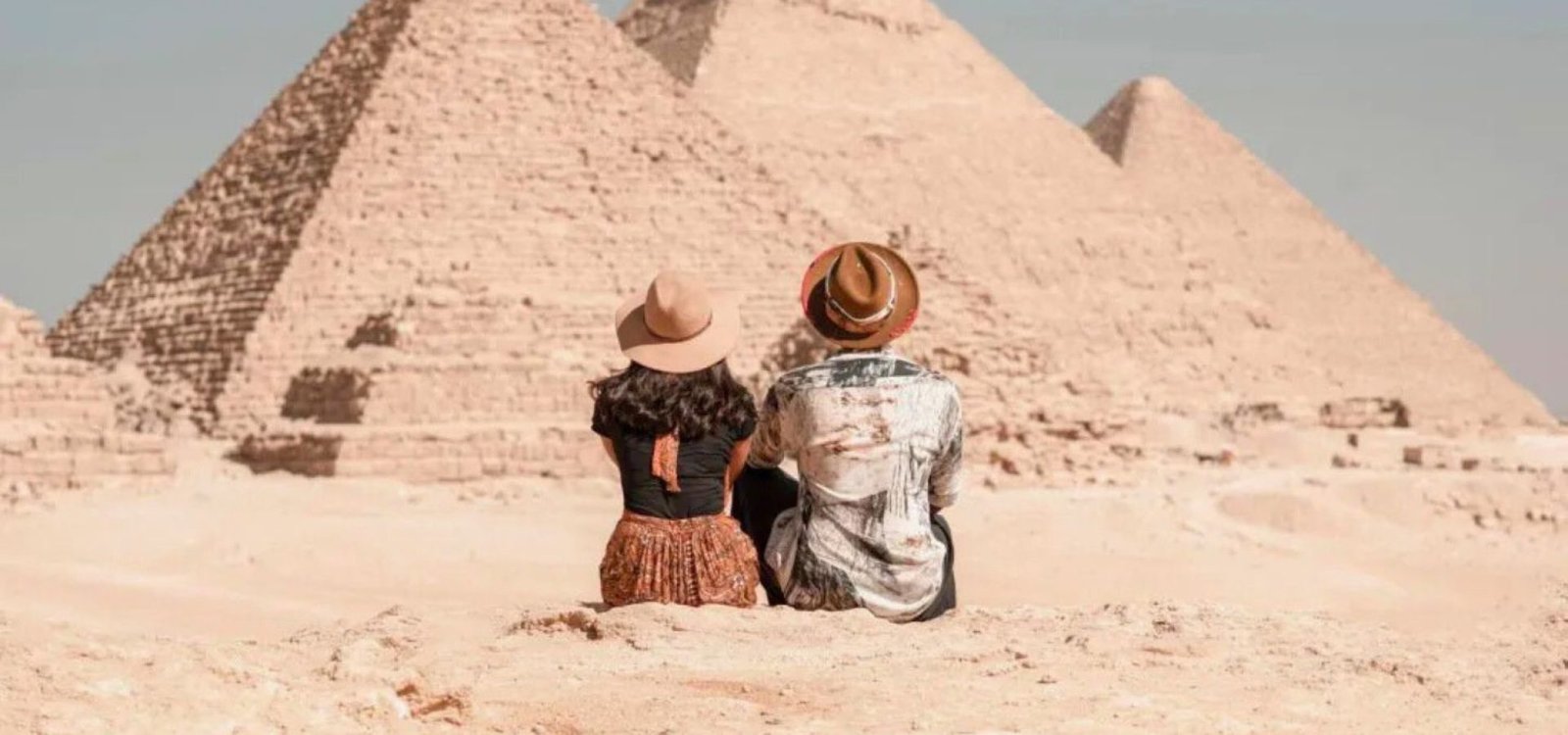 travelers at the pyramids of giza egypt
