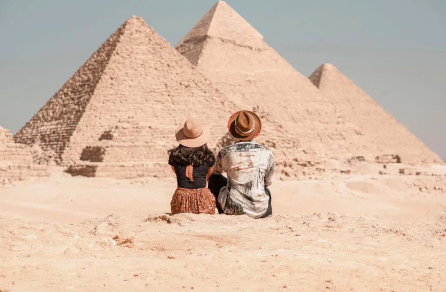 travelers at the pyramids of giza egypt
